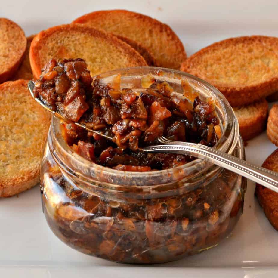 Bacon Jam is a bacon based relish that is made by slow cooking bacon, onions, garlic, brown sugar, vinegar and spices