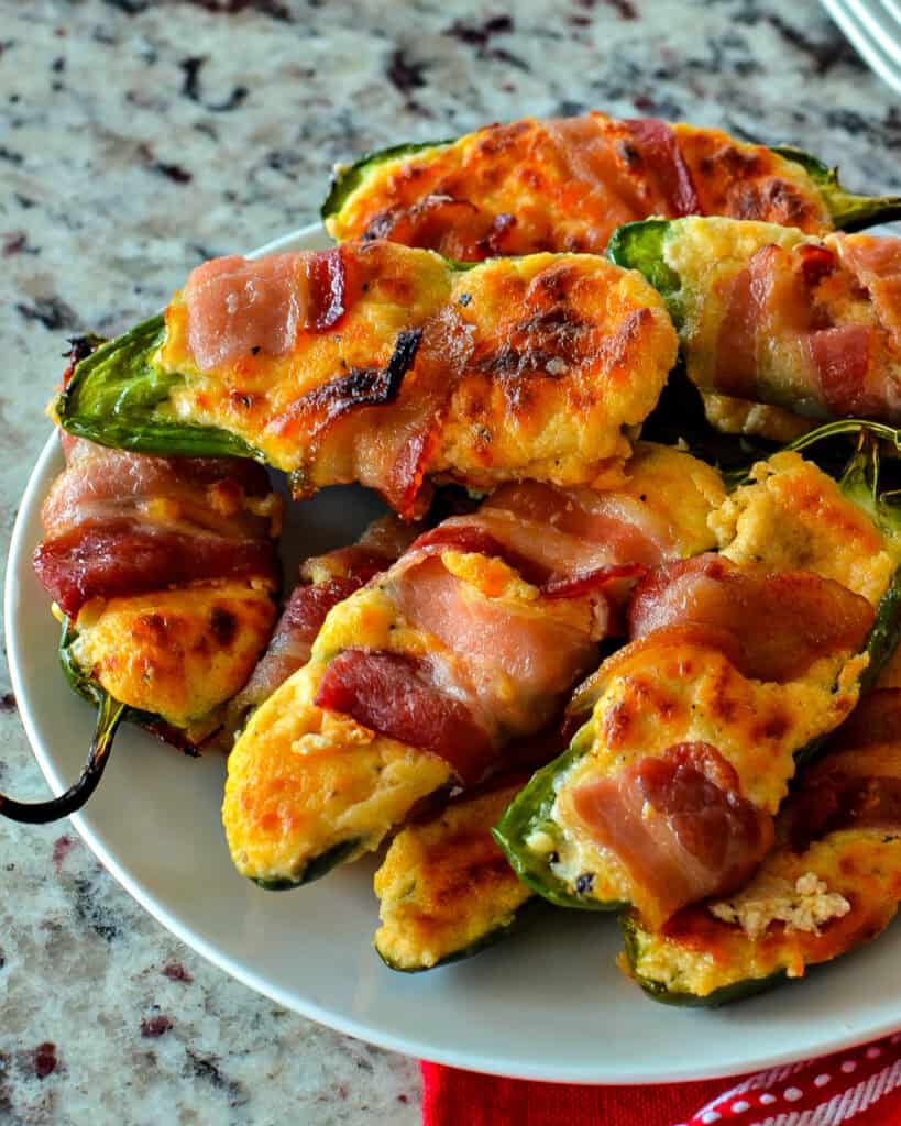 Plated bacon-wrapped jalapenos.