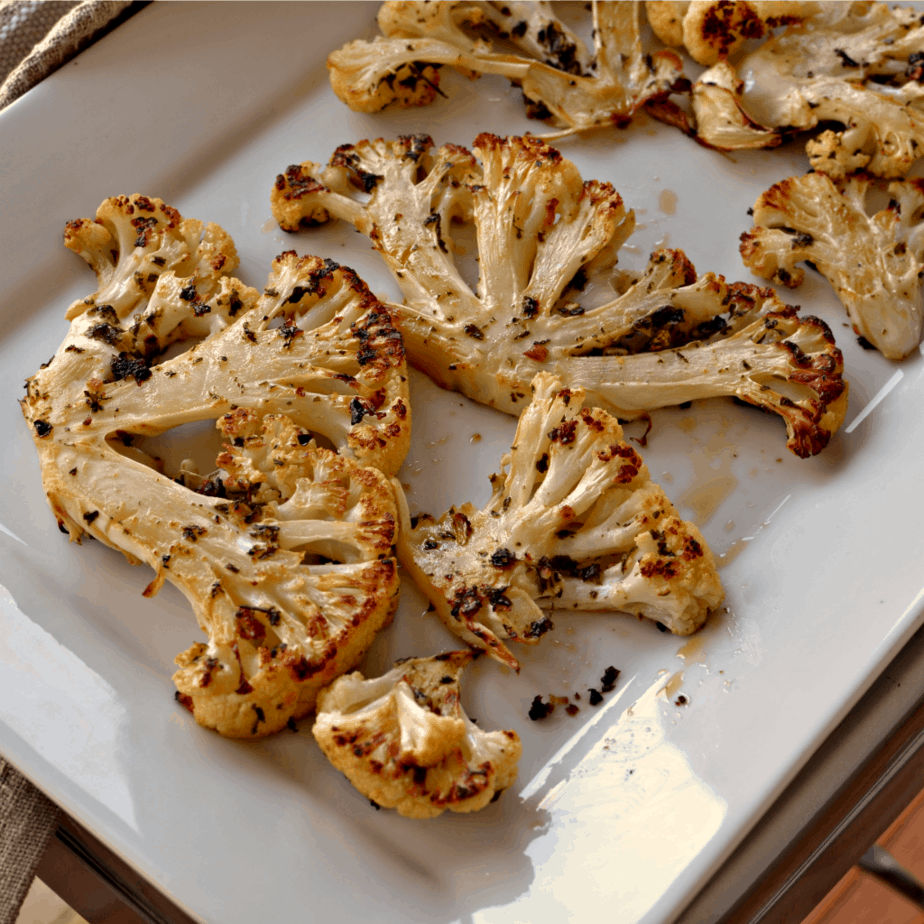 Perfectly seasoned Cauliflower Steaks baked to a crisp perfection