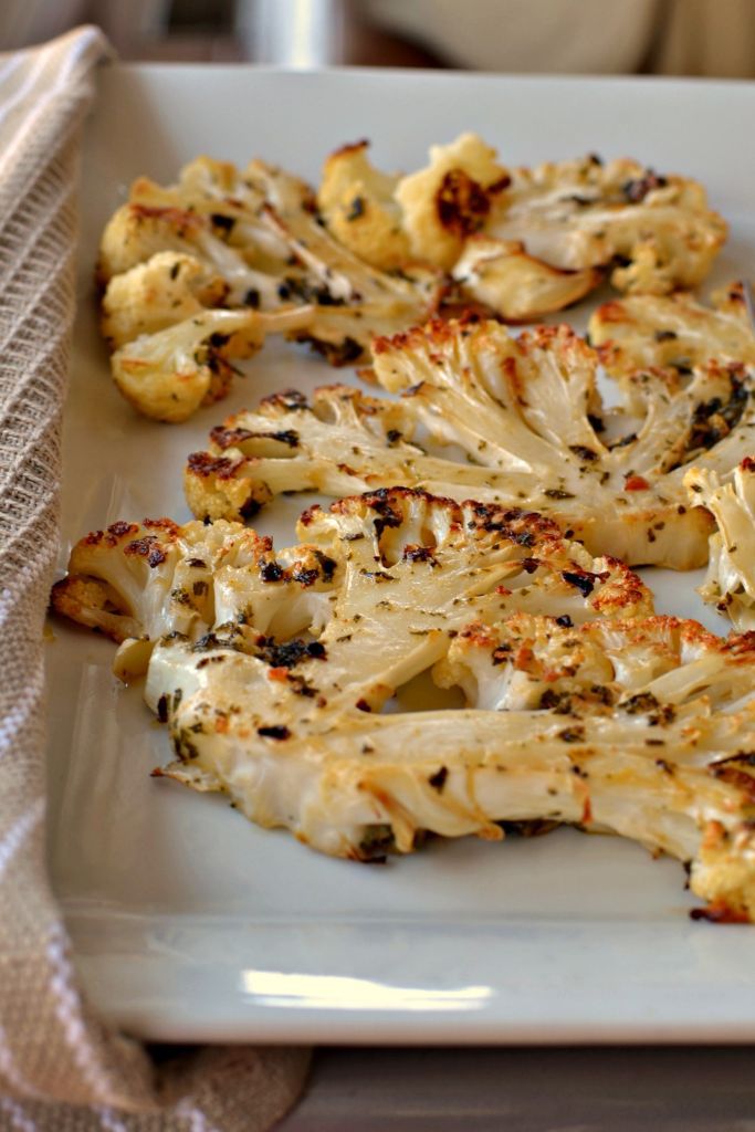 Cauliflower Steaks make a great dinner side. Perfectly seasoned slices of cauliflower baked to perfection