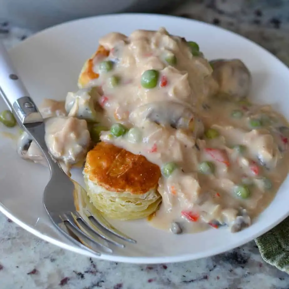 Chicken a la king is a hearty creamy dish with chicken, peas, peppers, mushrooms, and pimentos.