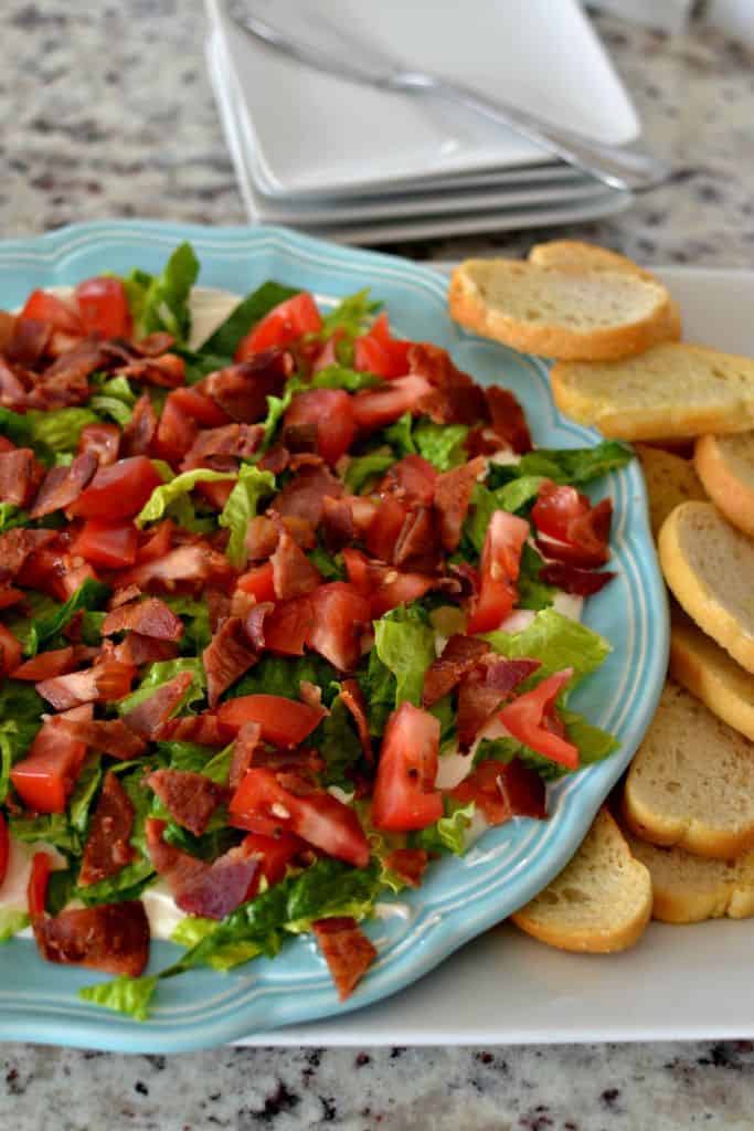 BLT Dip is best paired with fresh baked crostini for a delicious party appetizer