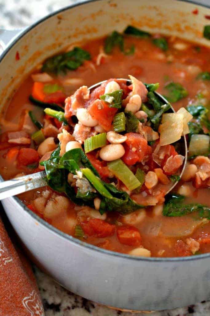 Tuscan White Bean Soup is packed with veggies in a rich tomato broth