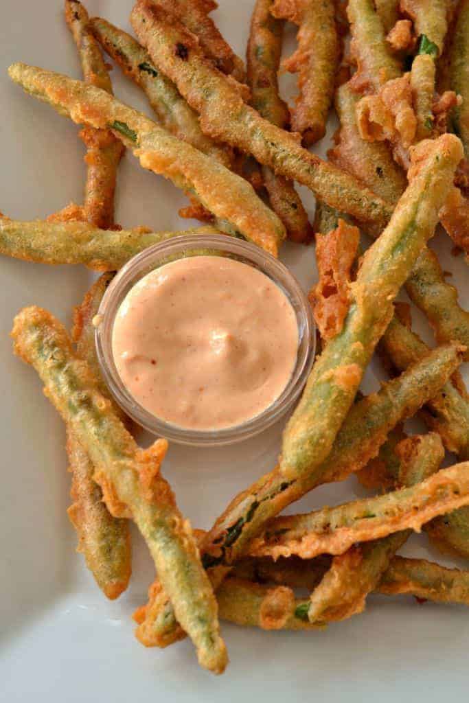 These Crispy Fried Green Beans will hit the spot just right with a slightly spicy crunchy crust on tender fresh green beans.