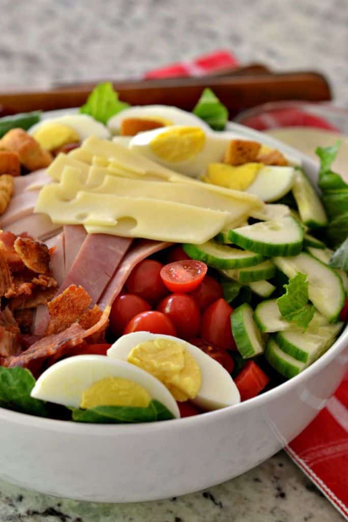 This easy and filling Chef Salad brings all the best protein together with fresh tomatoes, cucumbers and seasoned croutons.