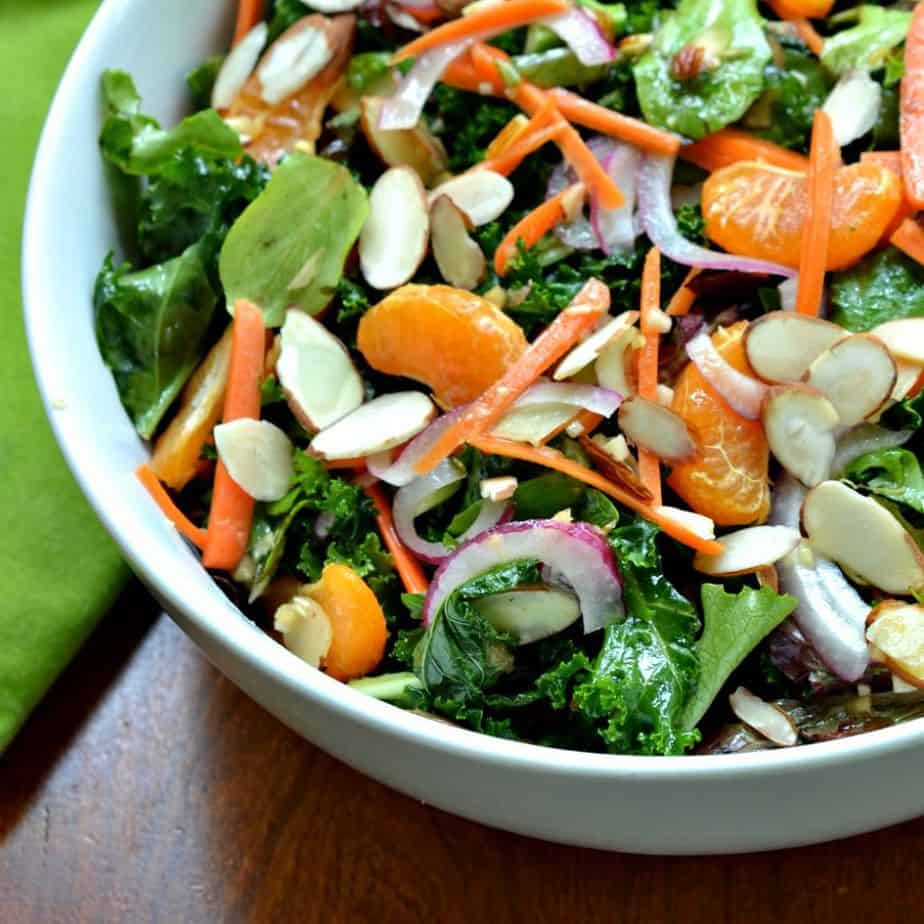 This fresh and flavorful kale salad is topped with a homemade ginger Vinaigrette for an sweet Asian zing