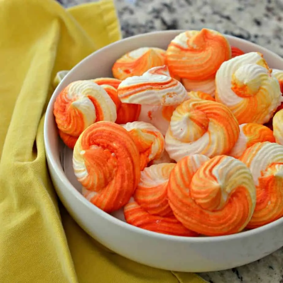 Orange Meringue Cookies are delicious and gorgeous, making them the perfect special occasion cookies.  They are easy to pipe and easy to color.
