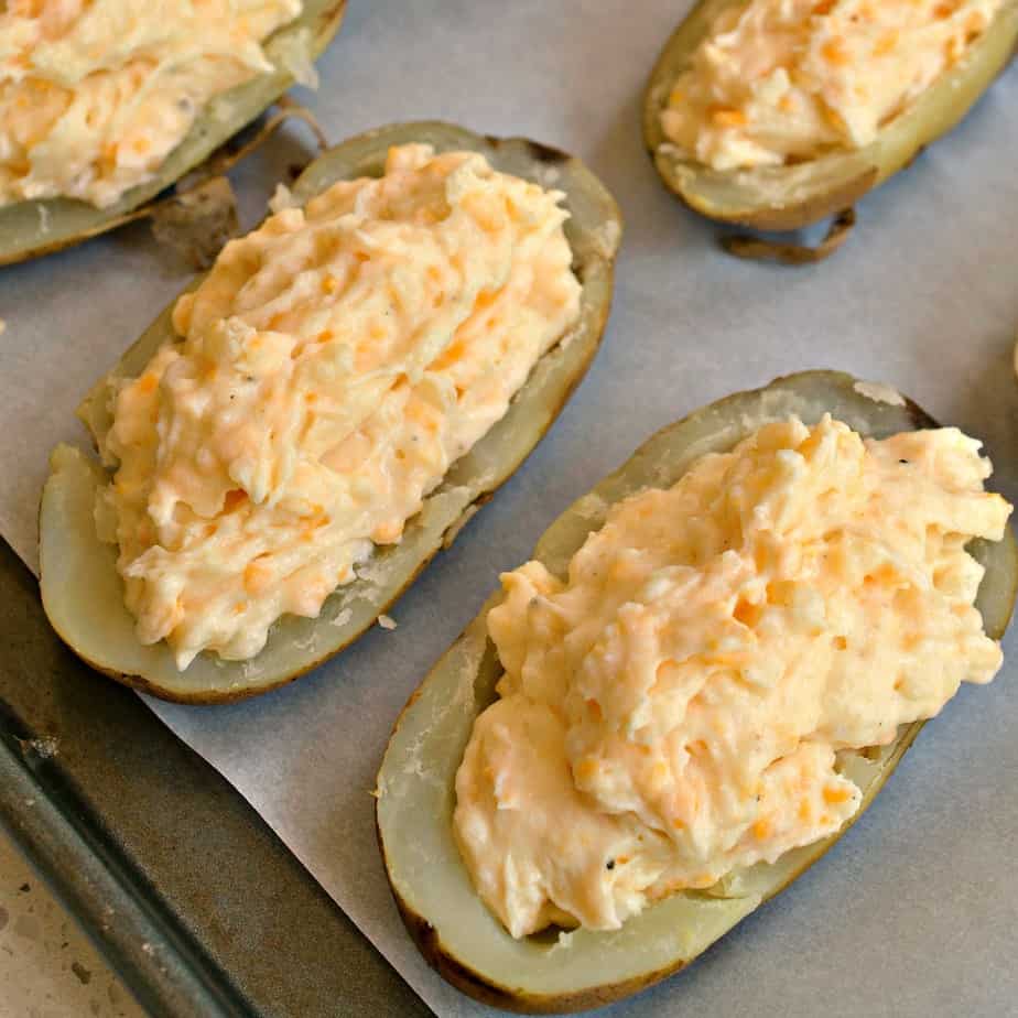 Twiced baked potatoes are filled with a delicious, creamy filling and baked to perfection.