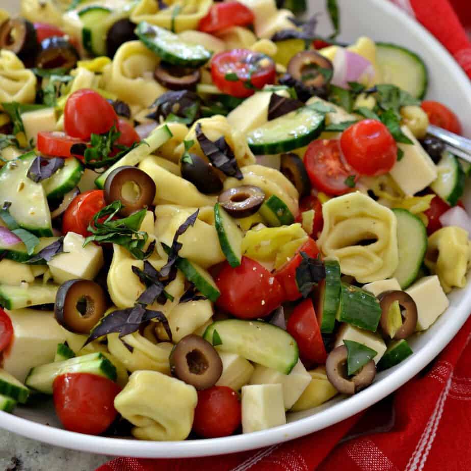 Pasta salad made with tortellini, fresh vegetables and Italian dressing. 