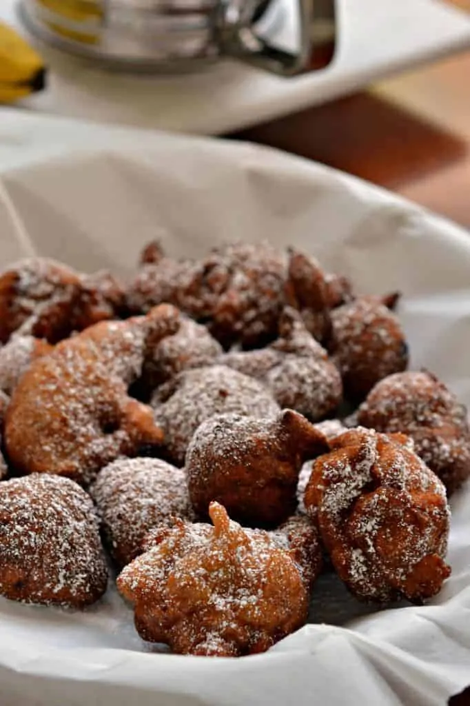 Dusted with powdered sugar, these crispy fried banana fritters are best served with some warm maple syrup
