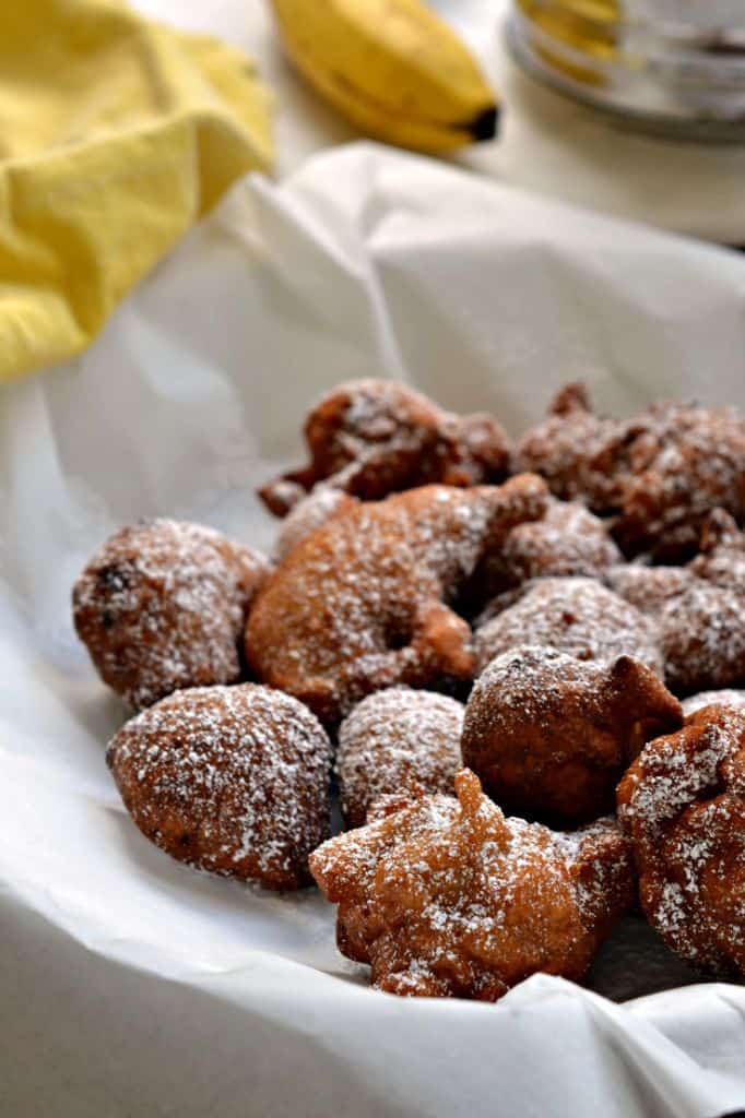 These delicious banana fritters are perfectly fried, coated with a sweet powdered sugar, and best served for breakfast with some warm maple syrup