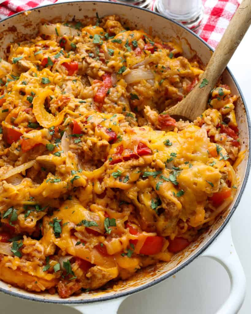 Chicken Fajita Rice Casserole A close up view of an ovenproof skillet full of chicken fajita casserole.