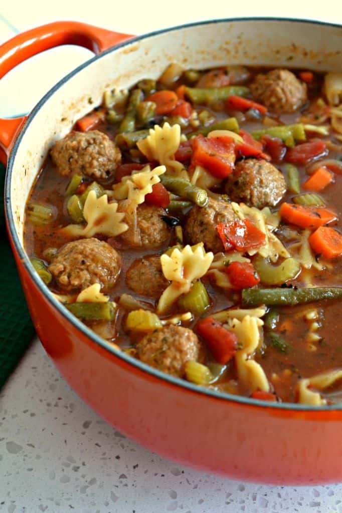 Soup with meatballs, carrots, celery and green beans. 