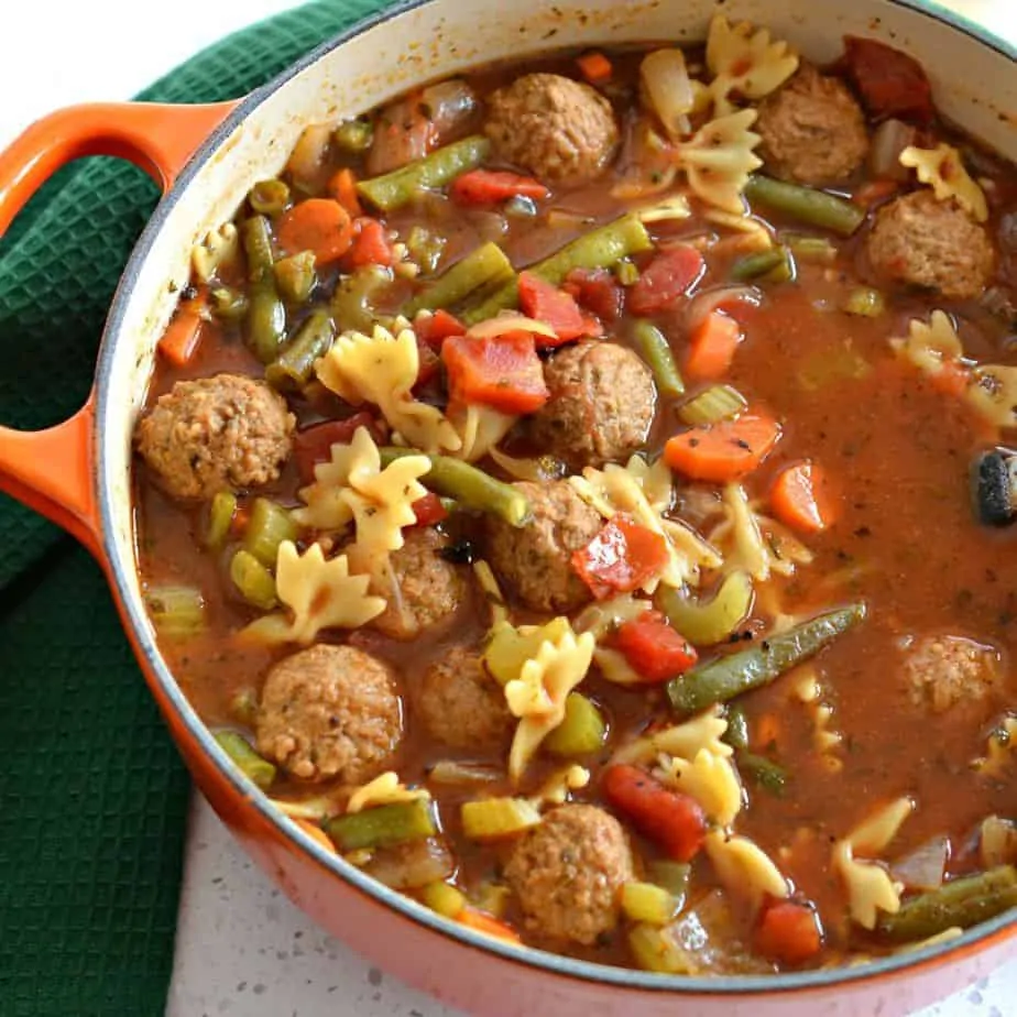 Meatball soup with carrots, celery and green beans. 