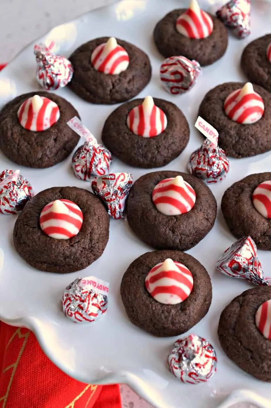 Easy Peppermint Chocolate Thumbprint Cookies are delicious buttery chocolate treats that are topped with a peppermint kiss.