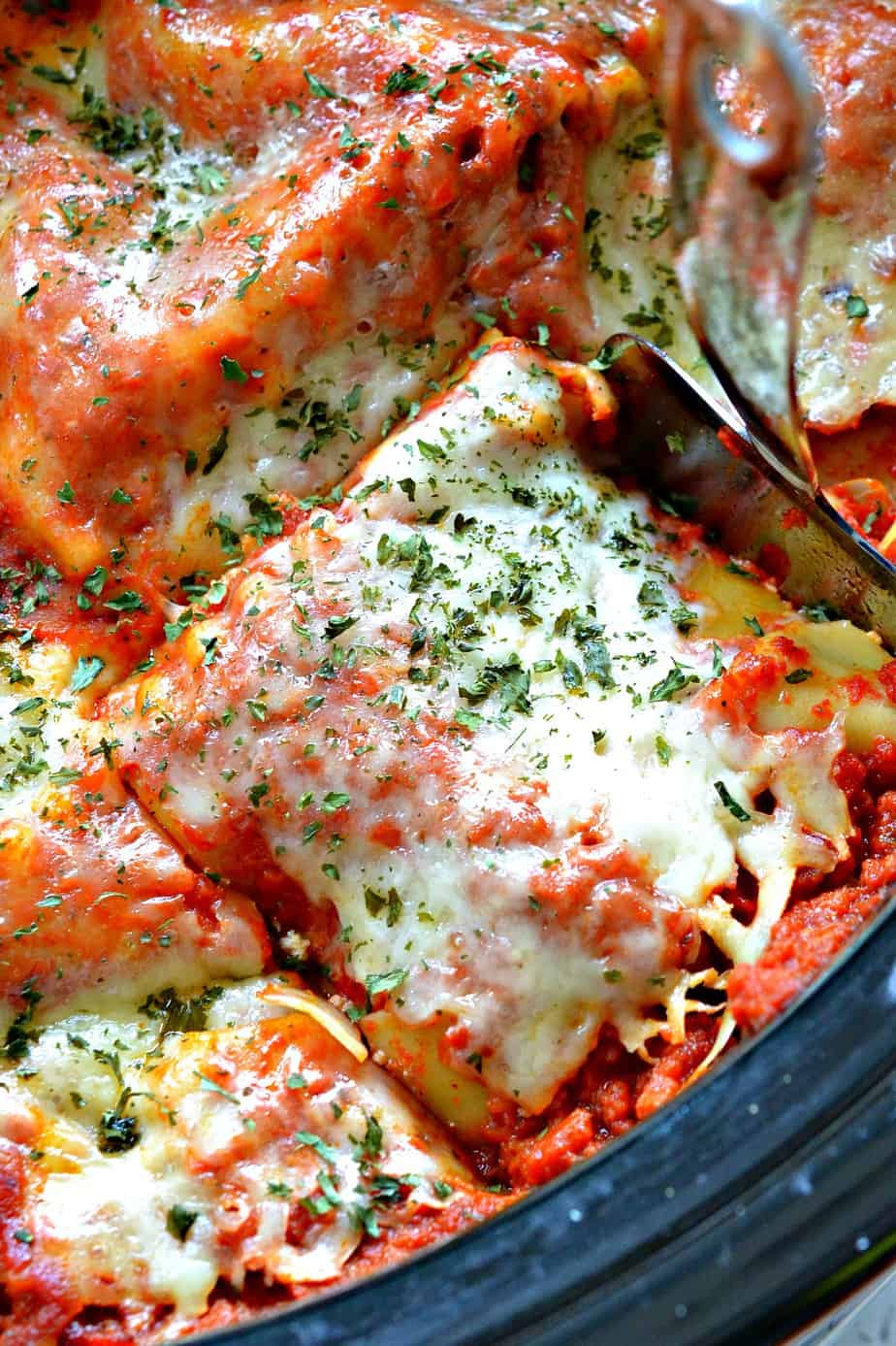 Rich and creamy Crock Pot Lasagna is layers of pasta, cheese, and rich sauce.