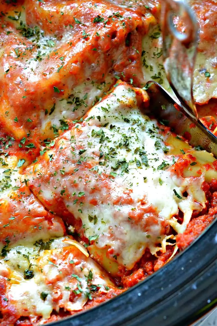 Rich and creamy Crock Pot Lasagna is layers of pasta, cheese, and rich sauce.