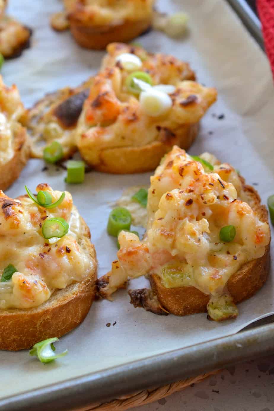 Fresh chopped shrimp, onion, celery and garlic all nested in a luscious sauce on crispy toasts. 