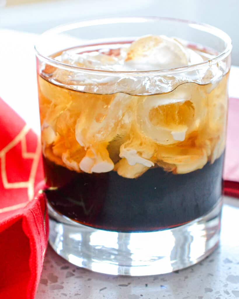 A white Russian cocktail in an old fashioned glass. 