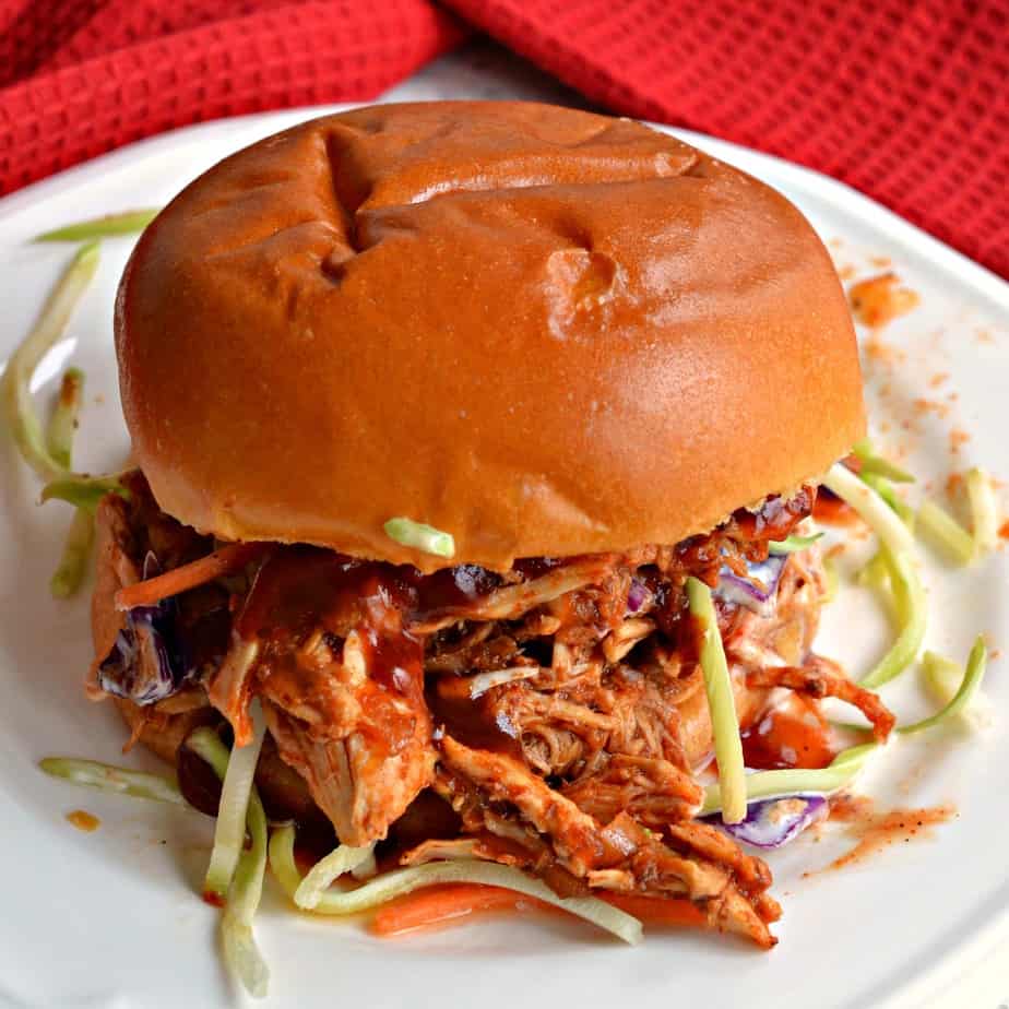 Mouthwatering good pulled chicken made easy with six ingredients in the crock pot.