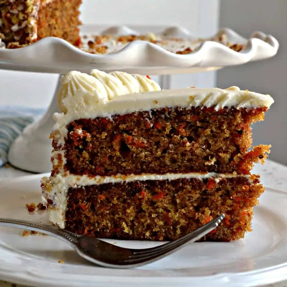 This holiday worthy Carrot Cake is a perfectly moist delectable two layer classic carrot cake with cream cheese frosting.
