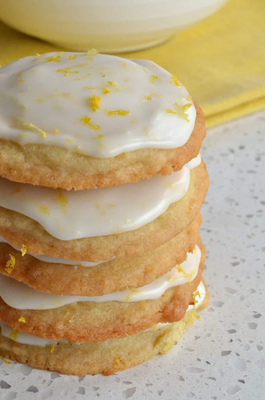 Family friendly Iced Lemon Cookies are soft on the inside with slightly crispy edges all topped with a sweet lemon glaze.