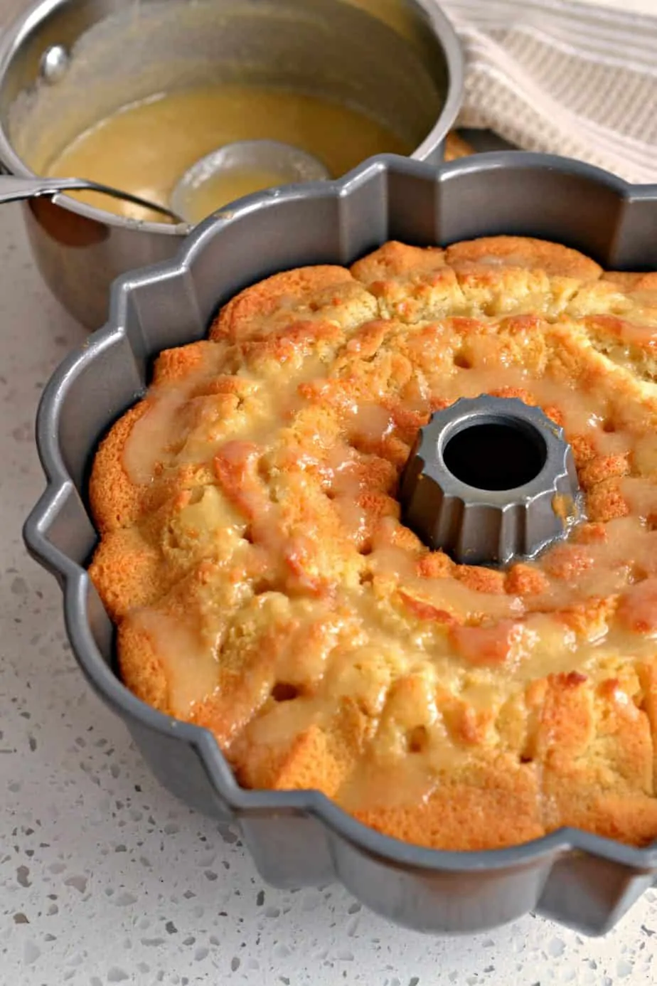  The butter sauce is brushed on the outside of the cake, creating a heavenly crisp crust that takes this cake over the top with the flavor of vanilla and butter. 