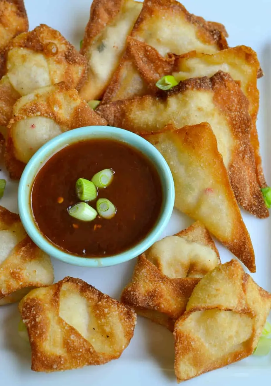 Crab Rangoon are wonton shells filled with fresh crab and cream cheese, then fried to a crispy golden brown. 