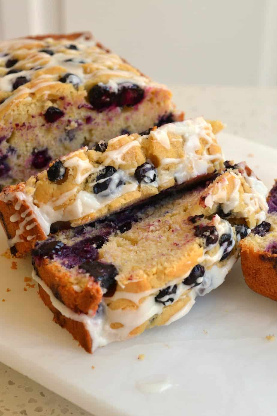 Easy family friendly Lemon Blueberry Bread is drizzled with a two ingredient sweet lemon glaze.