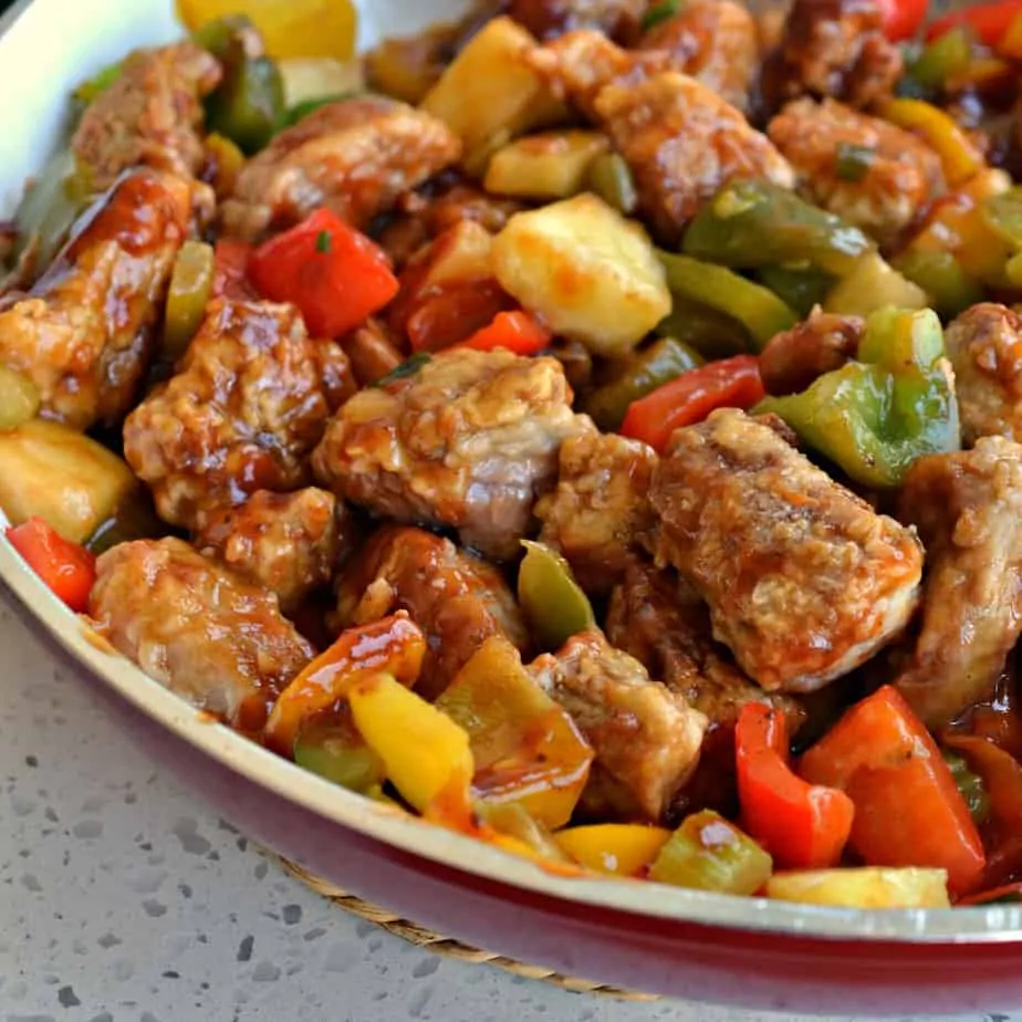 Crispy breaded pan fried pork tenderloin bites combined with sweet bell peppers and pineapple in a ginger Asian sauce.