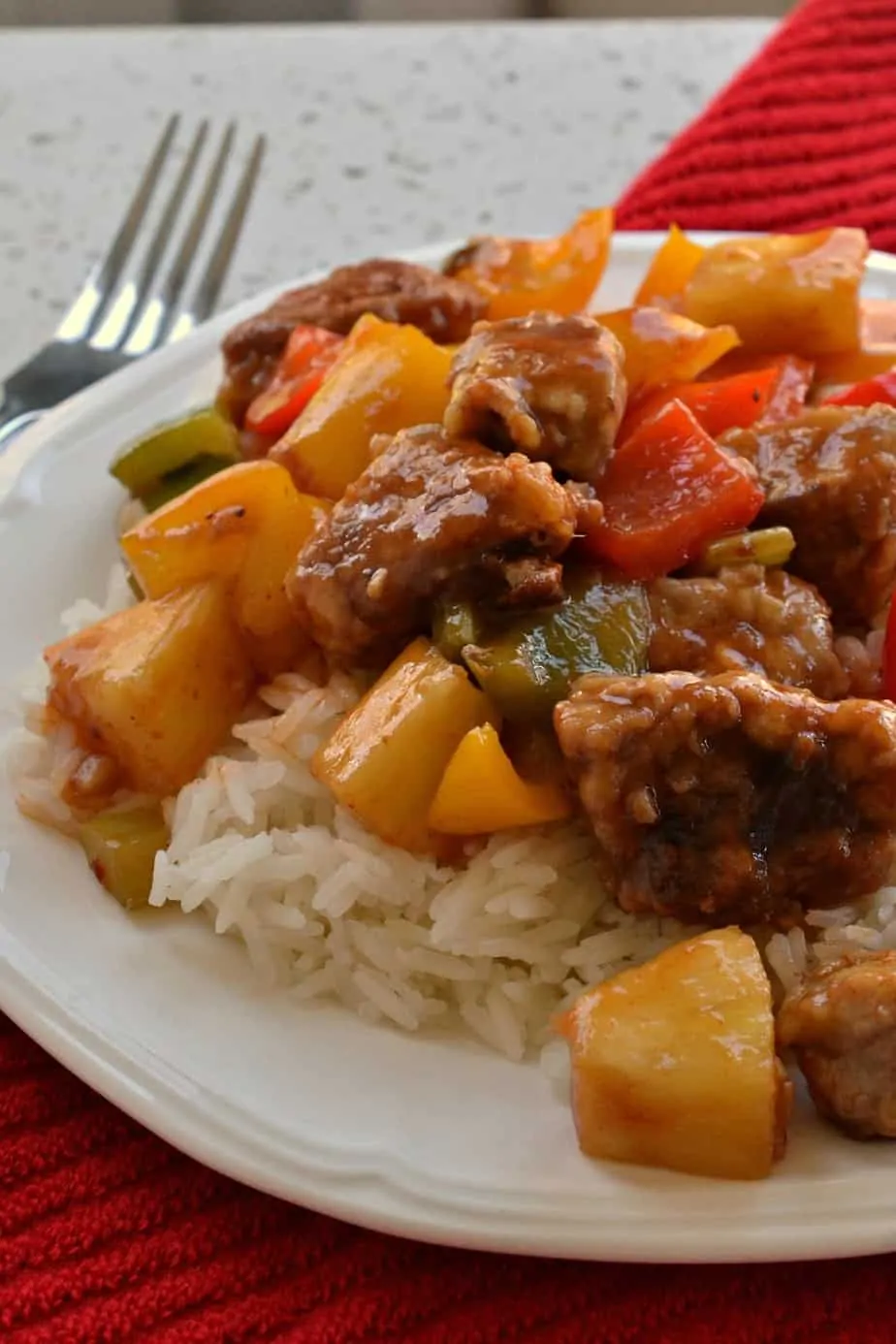 This Sweet Sour Pork brings crispy fried pork together with garlic, celery, sweet bell peppers and pineapple. 