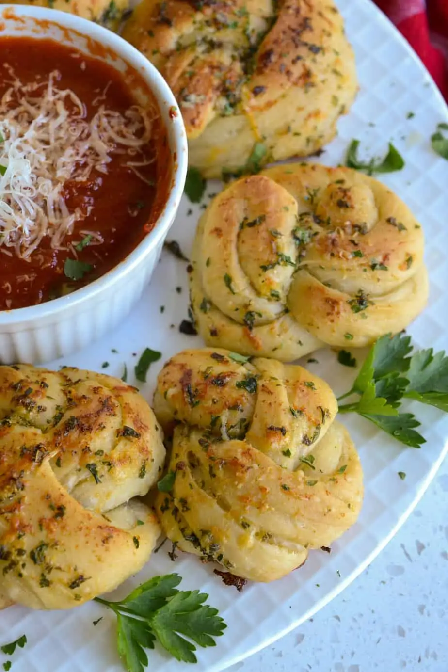 Yeast rolls topped with buttery herbs and fresh parmesan cheese. 