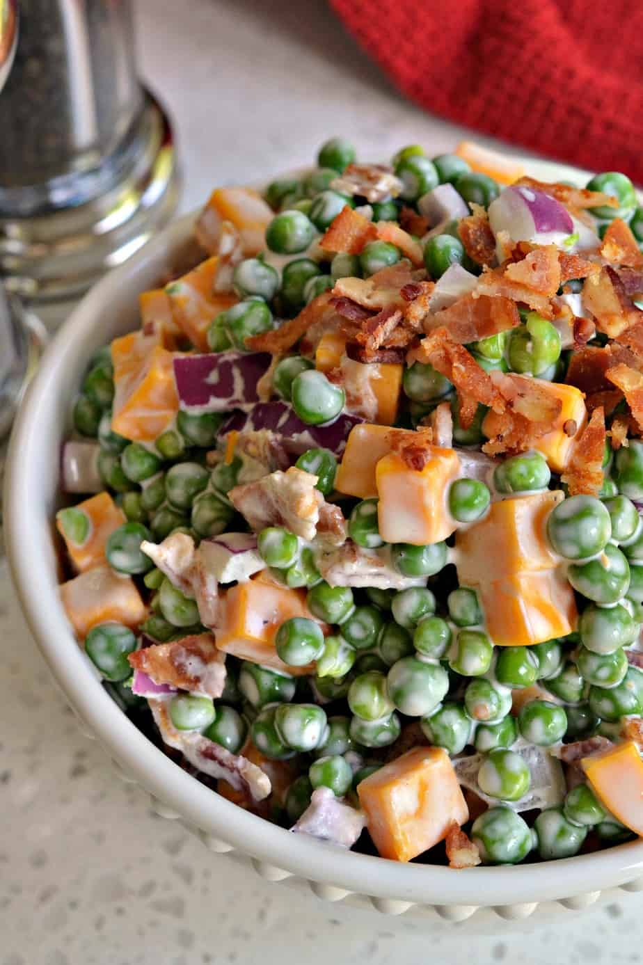 This delectable creamy pea salad comes together in less than ten minutes and is a favorite at family reunions, potlucks and picnics.