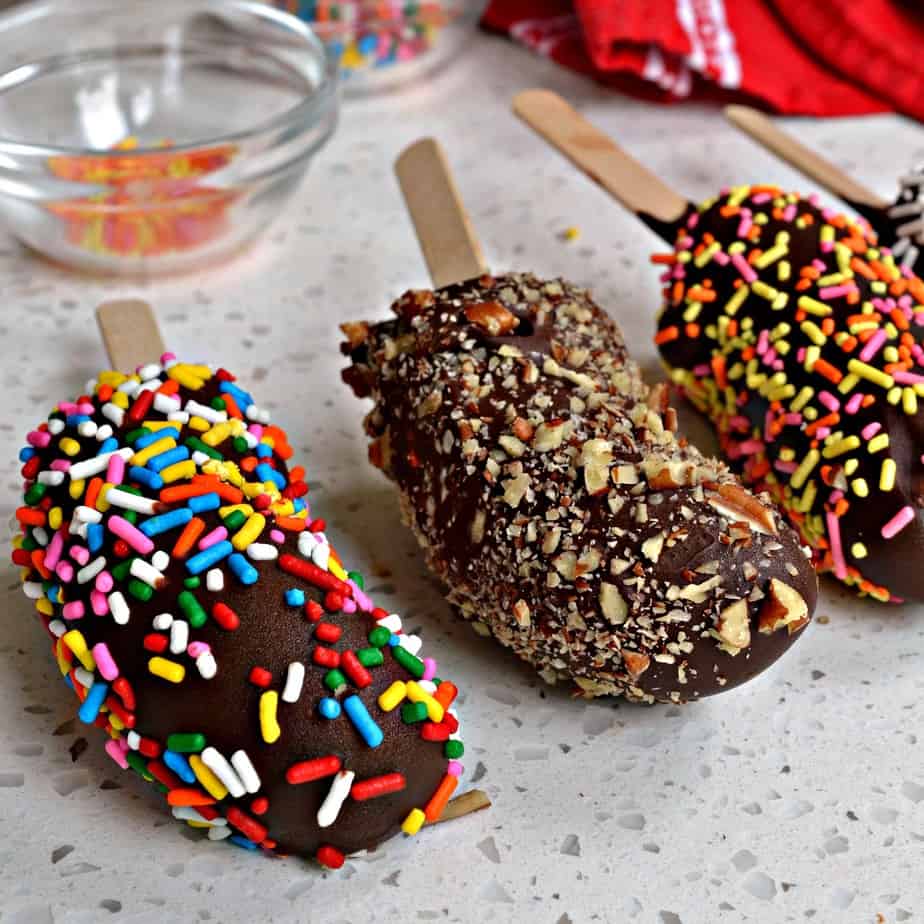 Customize these Frozen Chocolate covered Bananas to suit your taste buds with nuts, sprinkles, oats or crushed graham crackers.