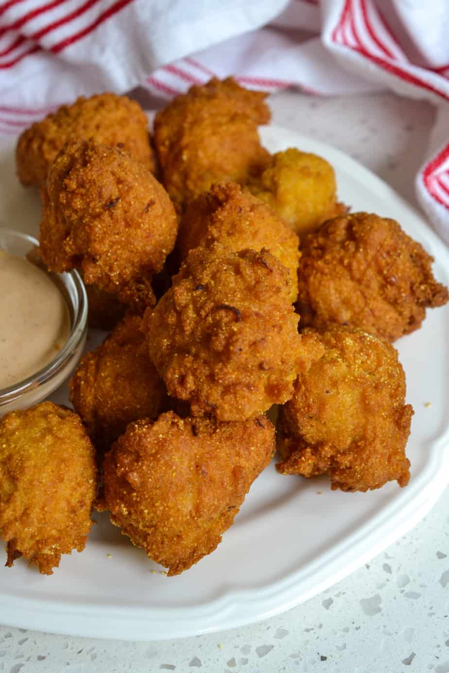 Fried dough balls with a spicy comeback sauce