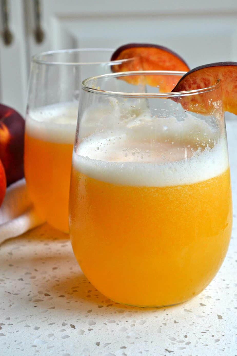 This mouthwatering good Peach Bellini recipe has four ingredients and only takes a few minutes of hands on time. 