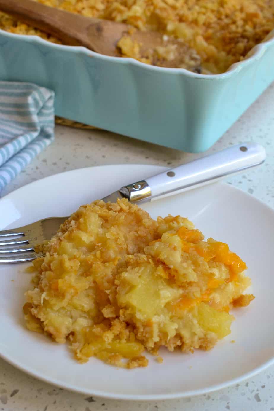Cheesy pineapple casserole on a plate