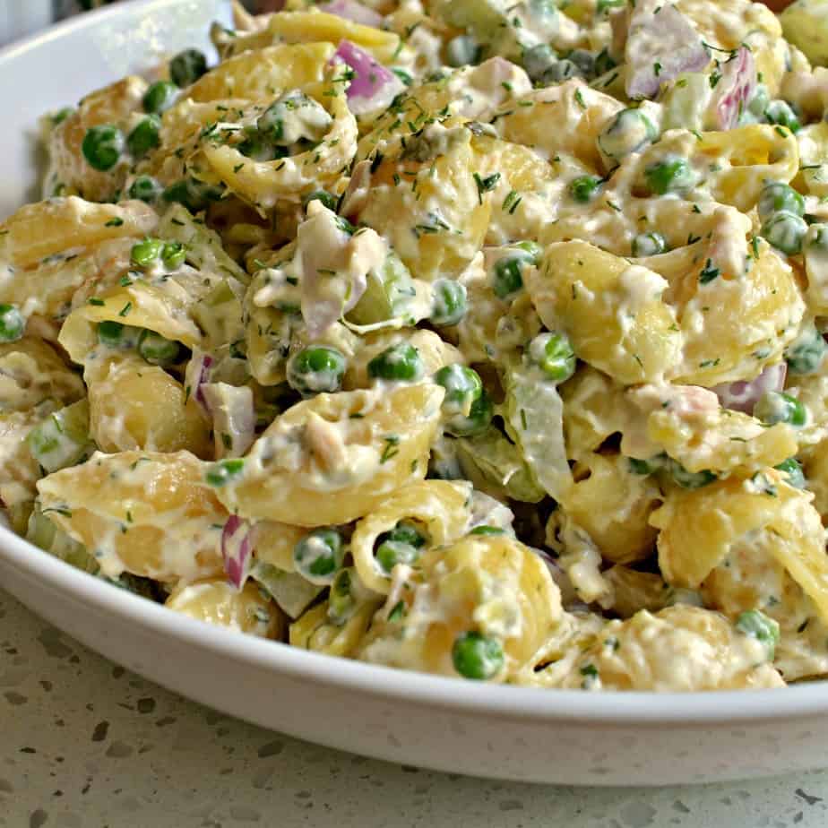 Creamy tuna and pasta salad with red onions and peas. 