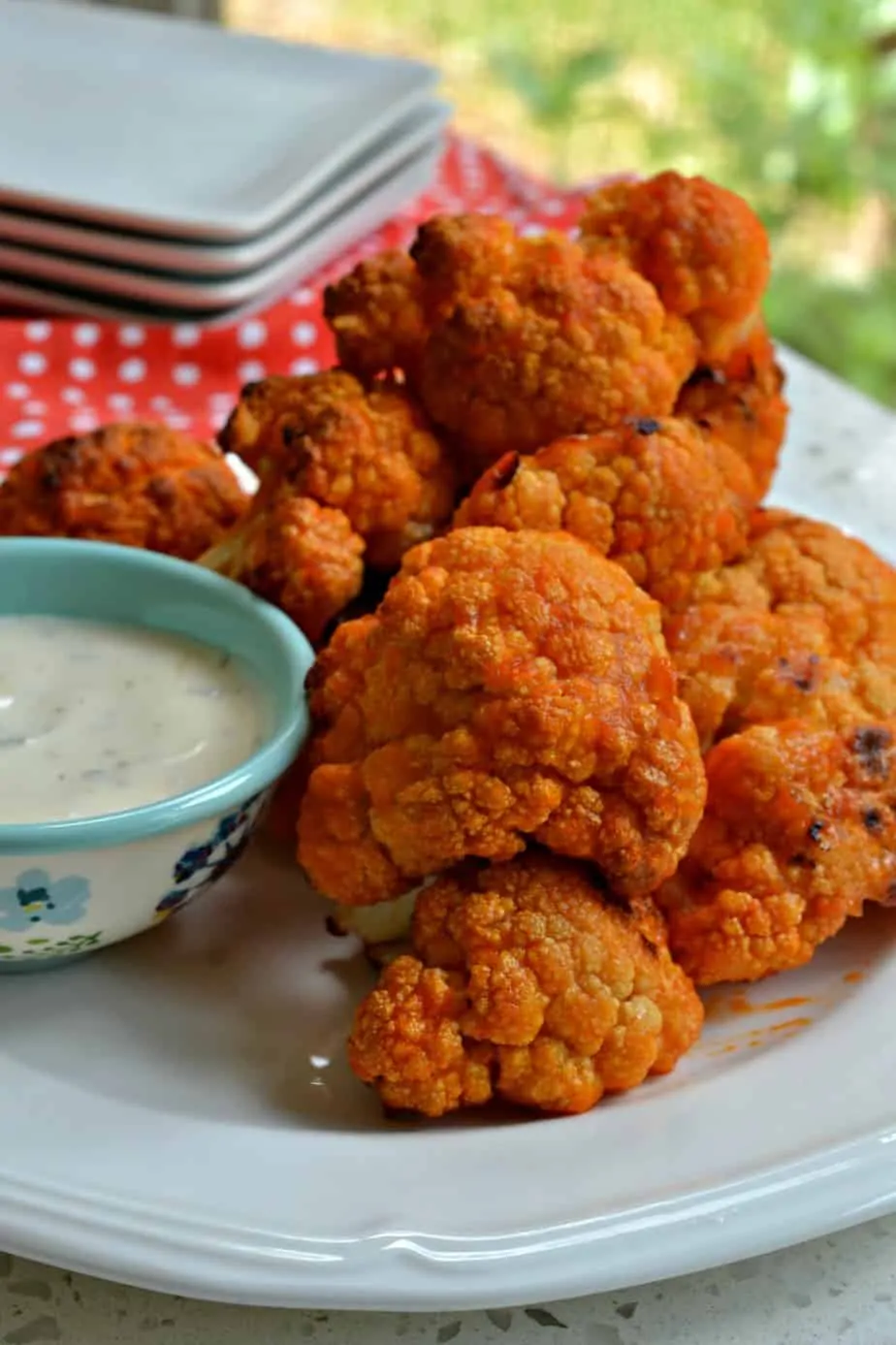 These delectable Buffalo Cauliflower bites are just as tasty as buffalo chicken with a lot less fat and calories.