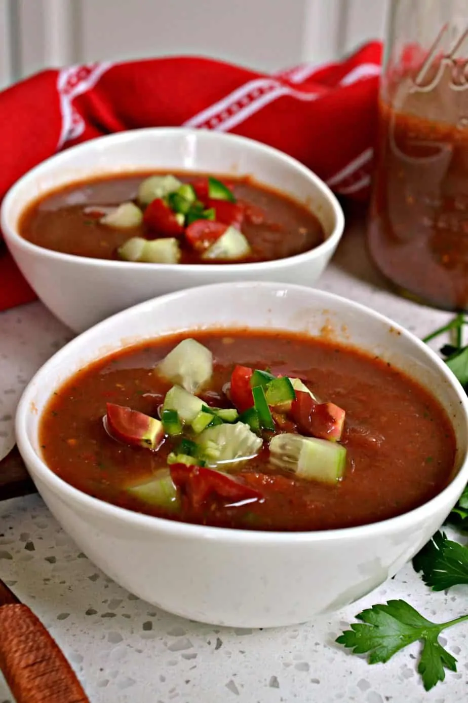 This Gazpacho Recipe with sun-ripened tomatoes, cucumbers, onions, and red bell pepper is made easy in a food processor. 