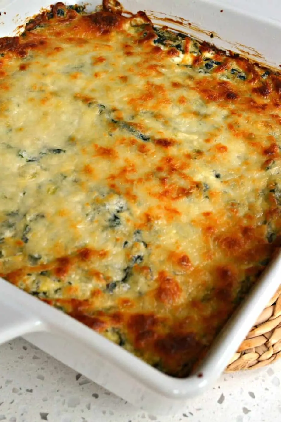 A delicious fun and easy hot Spinach Artichoke Dip prepped in less than ten minutes. 