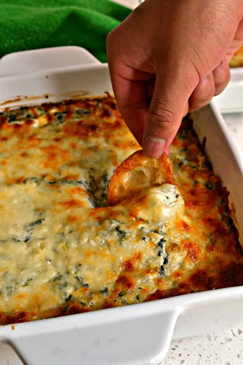 A super easy delectable cheesy spinach and artichoke party dip prepped in less than ten minutes.