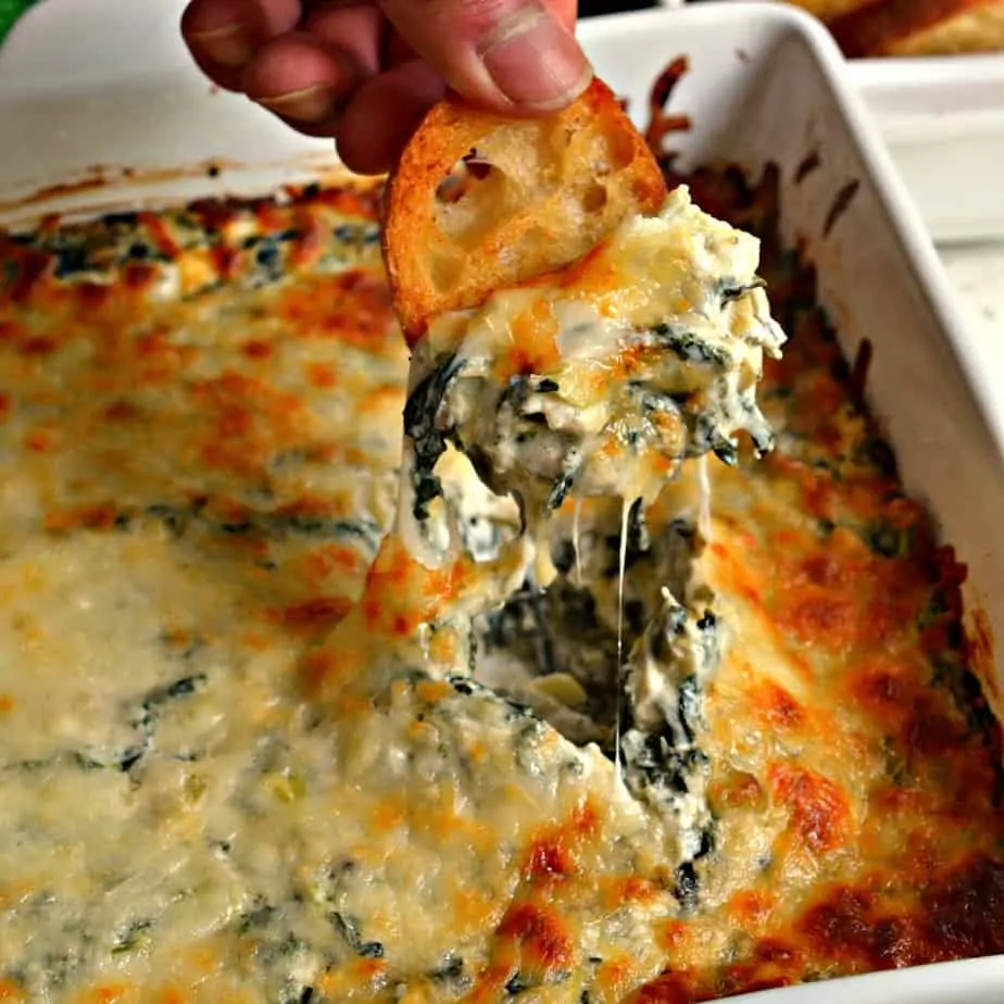 This Hot Spinach Artichoke Dip is a mouthwatering good hot mess that family and friends just love.