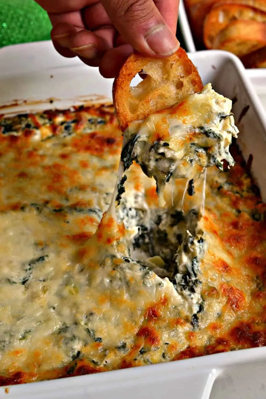 This Hot Spinach Artichoke Dip is a creamy cheesy delectable dip with garlic, Parmesan cheese, spinach and artichoke hearts.