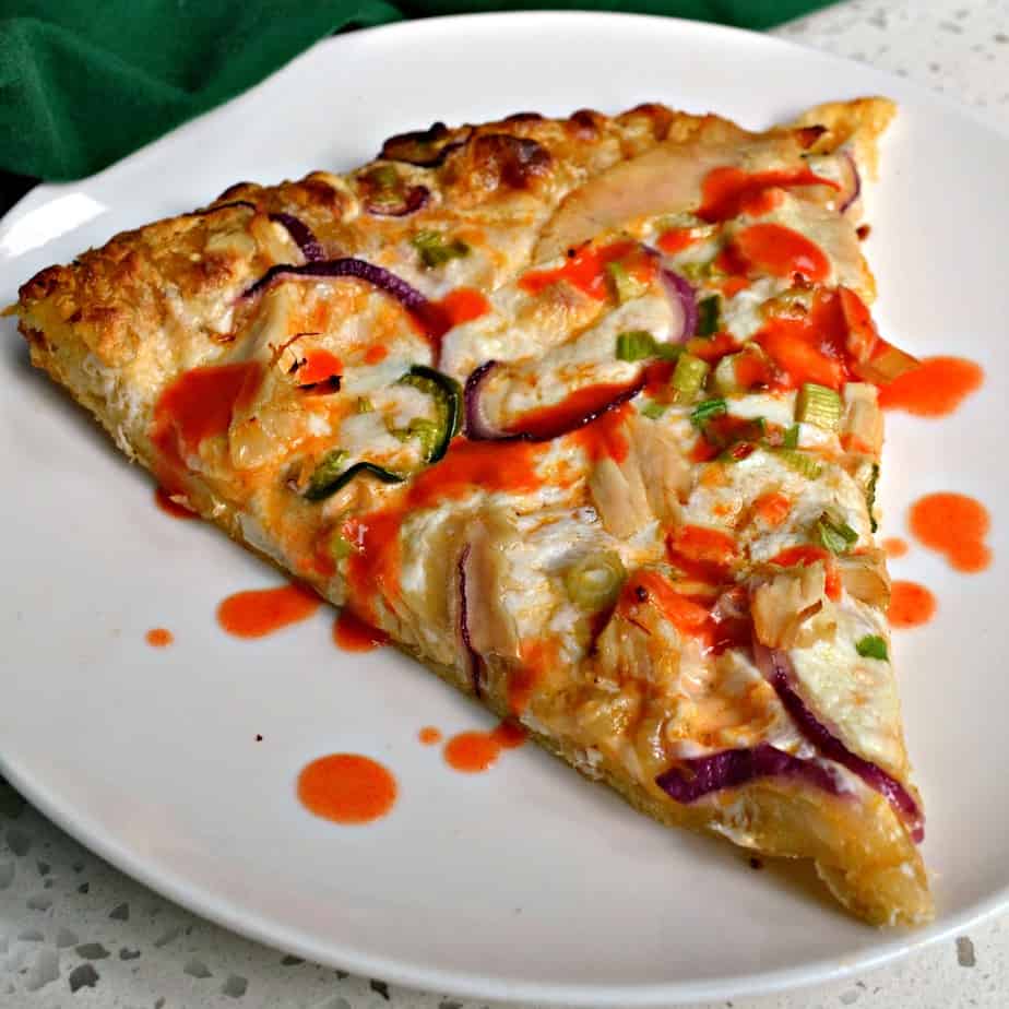 Buffalo Chicken Pizza is made with rotisserie chicken, red onions, slices of jalapeno and plenty of fresh mozzarella cheese.