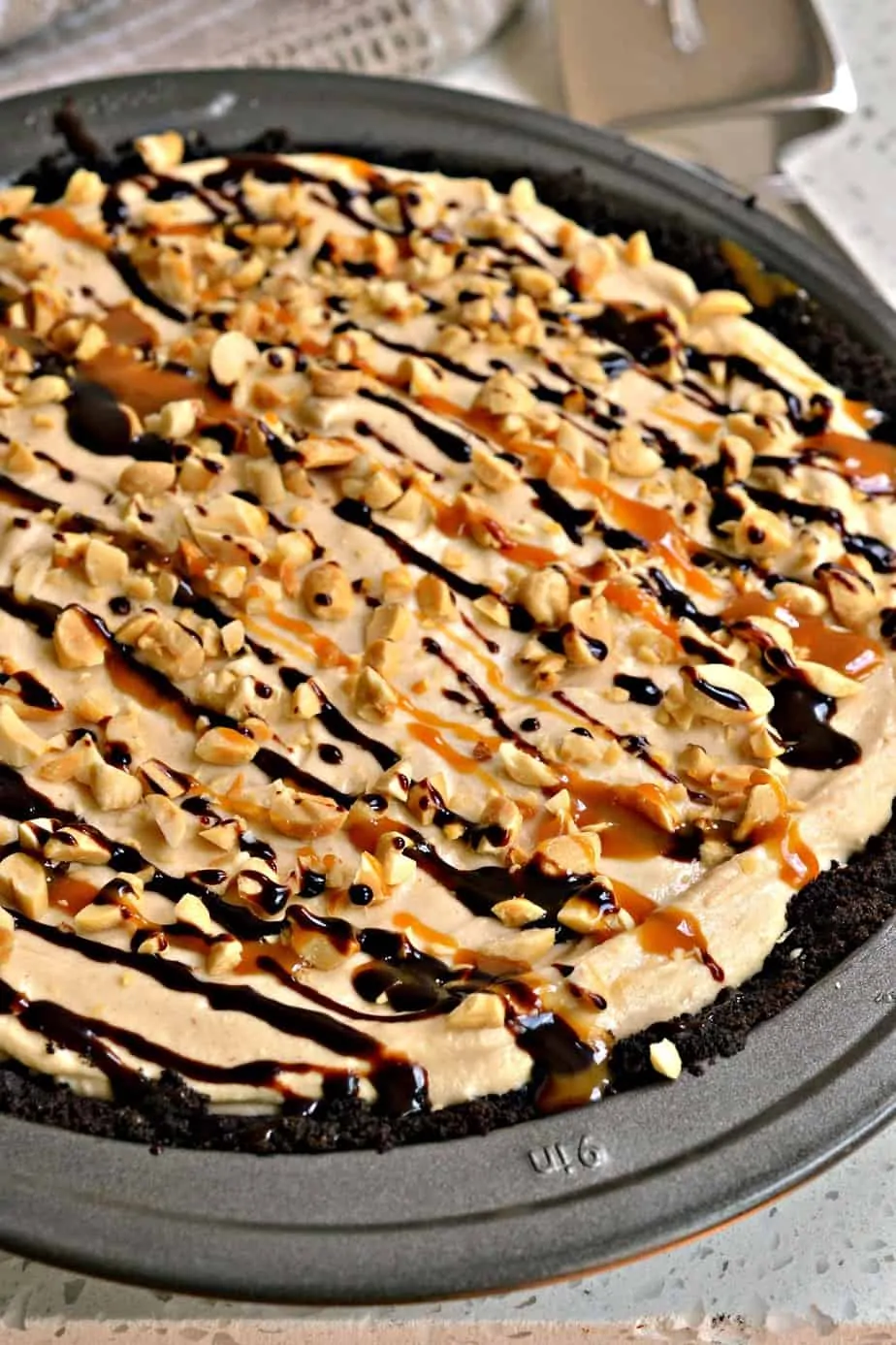 This easy Peanut Butter Pie is sure to please all your peanut butter lovers with a chocolate crust and cream cheese filling.