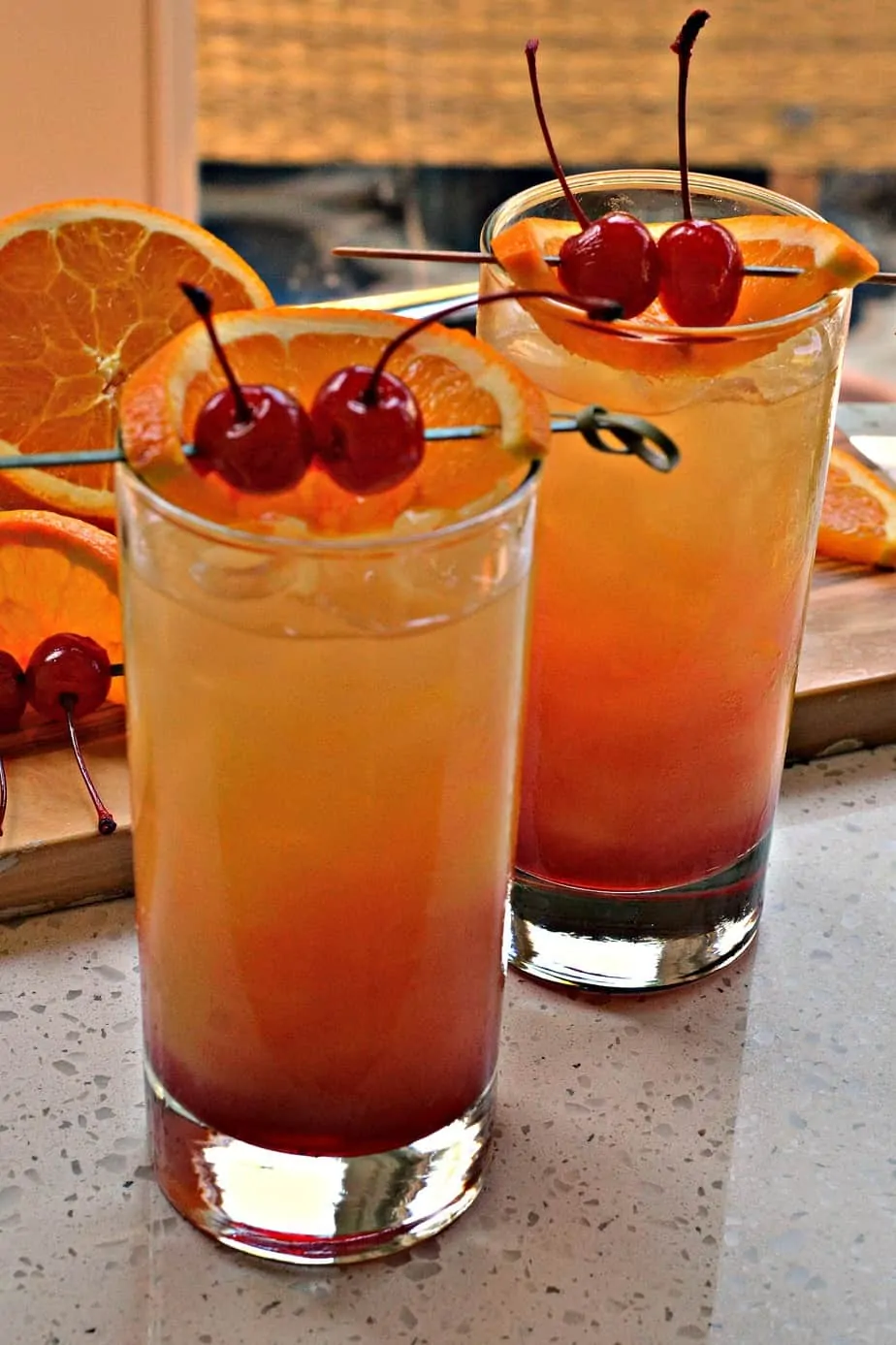 You don't have to be a professional bartender to make this beautiful three ingredient Tequila Sunrise cocktail. 