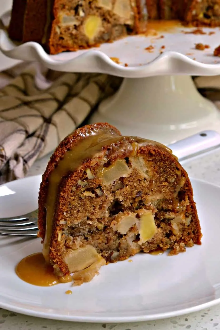 This Apple Cake has a slightly crunchy crust and a soft moist center that is loaded with chunks of sweet apple and pecans.