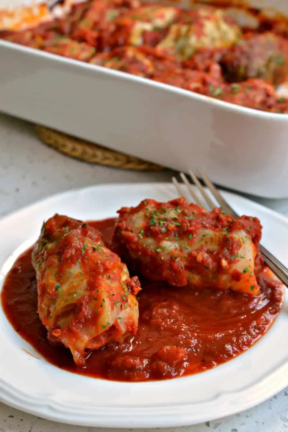 These traditional stuffed Cabbage Rolls are made with ground sausage and ground beef with a sweet and tangy tomato sauce.