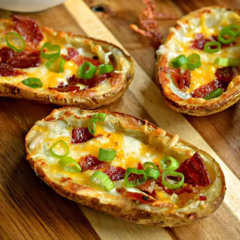 These extra crispy better than restaurant quality potato skins are topped with cheddar, Monterey Jack, bacon and onions.